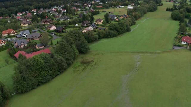 Drone shot of flooded field and misty mountains