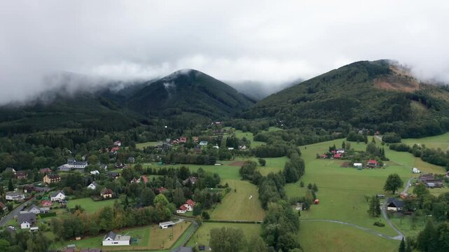 Drone shot of misty and cloudy mountains