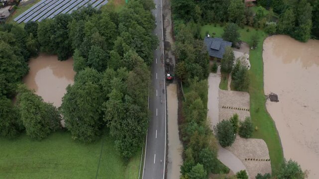 Drone shot of flooded road with lake