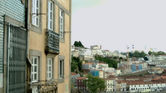 A house facade with the town in the background in Porto, Portugal.