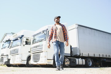 Professional truck driver Standing in front of the semi truck.