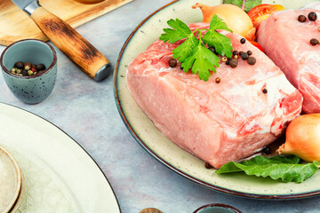 Raw pork meat and vegetables.