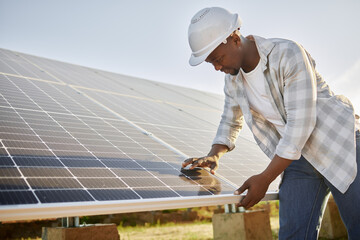 Black man, solar panel and renewable energy for connection, sustainable or clean power. Engineer, alternative generator and carbon neutral technology in conservation, environment or green electricity © DavisShared/peopleimages.com