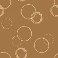 Abstract coffee and tea stain seamless pattern on light brown background