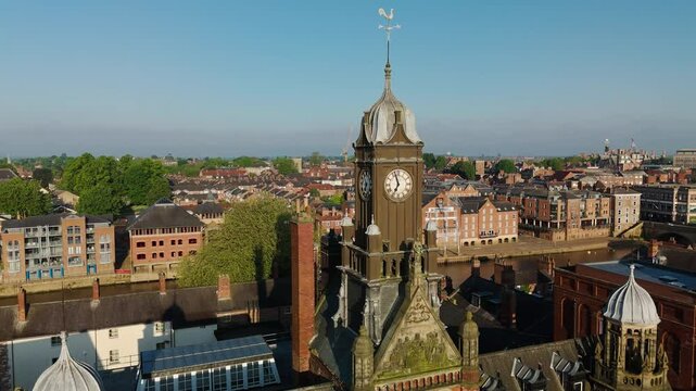 Establishing Drone Shot of York City and River past Magistrates Court Clock Tower UK