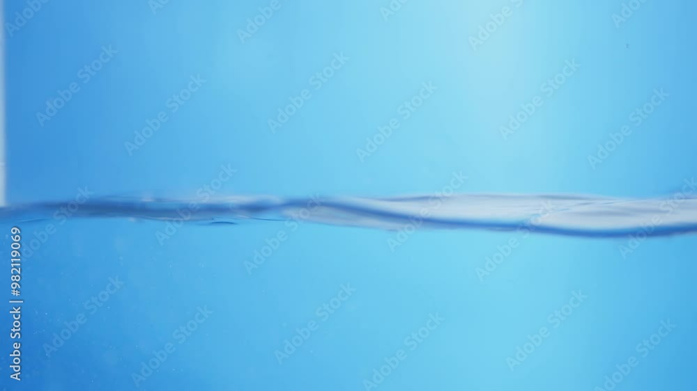 Poster crystal clear ripple effect. water droplets creating smooth waves in a calm surface.