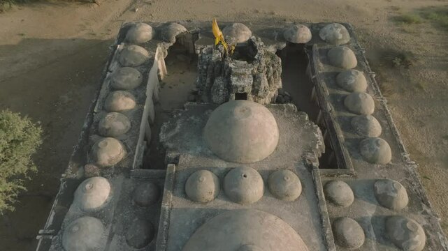 Drone shot reveals ruins of Nagarparkar Jain Temple, Gori temple building architecture with domes and canopies, Sindh province