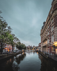 Dramatic canal view of central Amsterdam during the evening