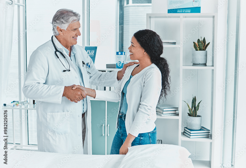 Wall mural Doctor, woman and handshake in office for welcome, greeting and friendly service in healthcare. Mature gynecologist, patient and gesture in practice for trust, consultation and assurance in clinic