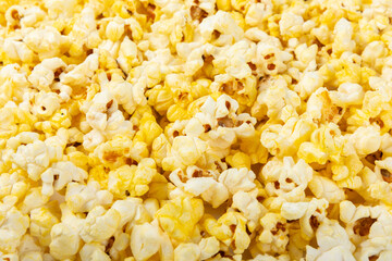 Salty popcorn on bright color background. Cinema and entertainment concept. Movie night with...