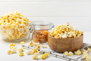Salty popcorn on bright color background. Cinema and entertainment concept. Movie night with popcorn. Delicious appetizer, snack.Space for text, copy space. Banner