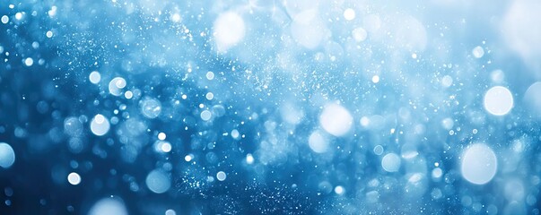 Obraz premium Beautiful blue background with sparkling bokeh effects, perfect for creating a serene and calming atmosphere in design projects.