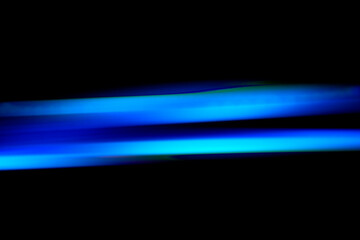 Abstract blurry background with blue and black colors. Freeze light photo effect. Wallpaper with vibrant motion colours 