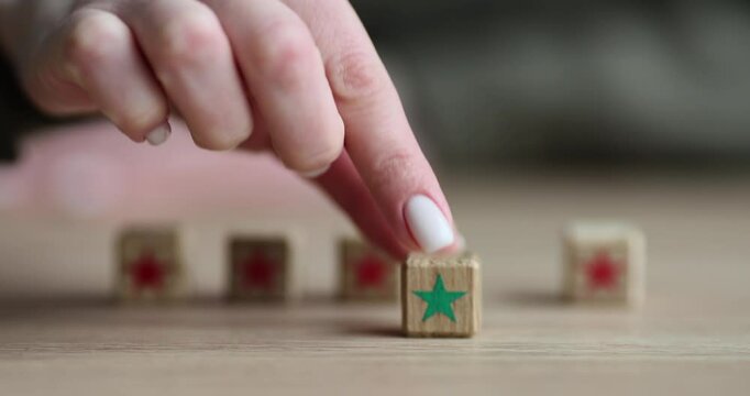 Customer selects fifth green star for review. Feedback and recommendation services concept