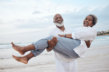 Happy, portrait and senior black couple on beach for travel, vacation or getaway with bonding. Love, excited and elderly man carrying wife by ocean or sea for retirement holiday together in Morocco. - Powered by Adobe