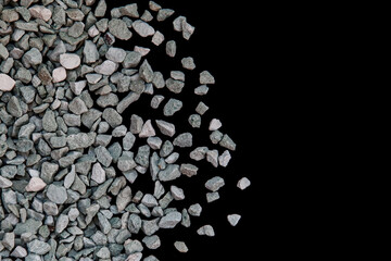 Small stones scattered on a black background