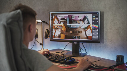 Young 3D designer creates and develops stylish house interior using PC and professional 3D modeling software or design app. Caucasian teenager works remotely on freelance project on computer at home.