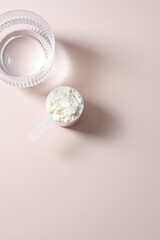 Collagen protein powder in a scoop. Top view, copy space
