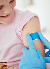 Hands, girl and smile with band aid as patient at clinic for immunization or vaccine for virus. People, doctor and happy kid with plaster for injection wound as prevention for disease and pandemic
