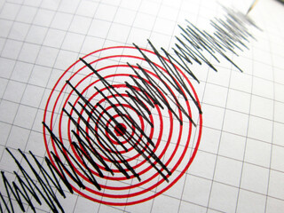 Seismograph and earthquake. A seismograph that records the seismic activity of an earthquake.