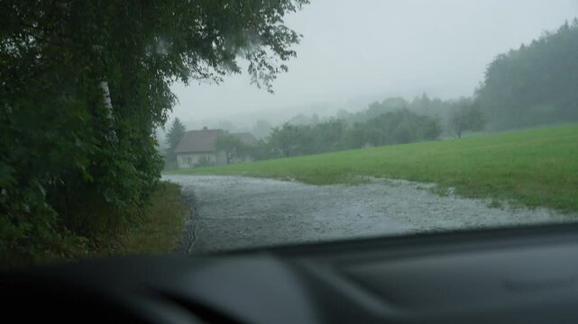 POV shot of car crossing flooded road