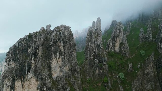 Lombardy, Italy - A Picturesque View of the Craggy, Rugged Summits of Grignetta Enveloped in Fog - Drone Flying Forward