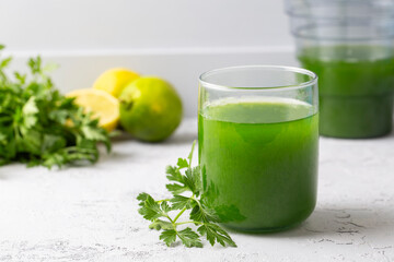 Green healthy detox, lemon and parsley juice. Green vegetable smoothie