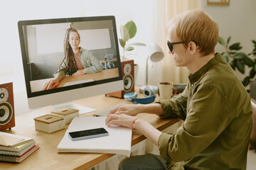 Unrecognizable man reading Braille book white spending free time at home