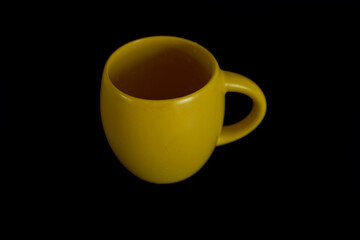  large yellow cup on a black background