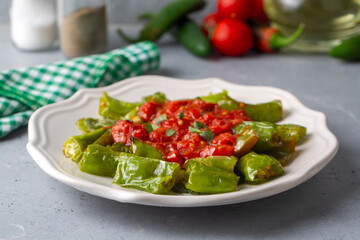 Fried green peppers with tomato sauce - Turkish name; domates soslu kizarmiş biber