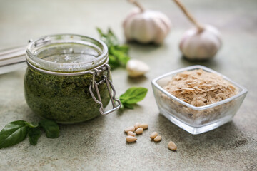Homemade Pesto sauce and ingredients: basil, pine nuts, deactivated yeast, garlic. Lactose-Free...