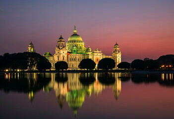 Fototapeta premium Victoria memorial lit up at sunset, Kolkata, India