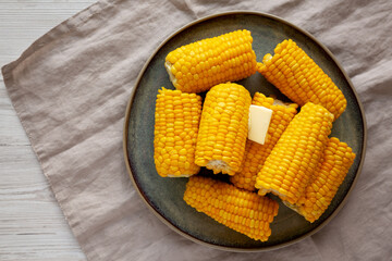 Homemade Organic Steamed Yellow Sweet Corn on the Cob with Butter, top view.