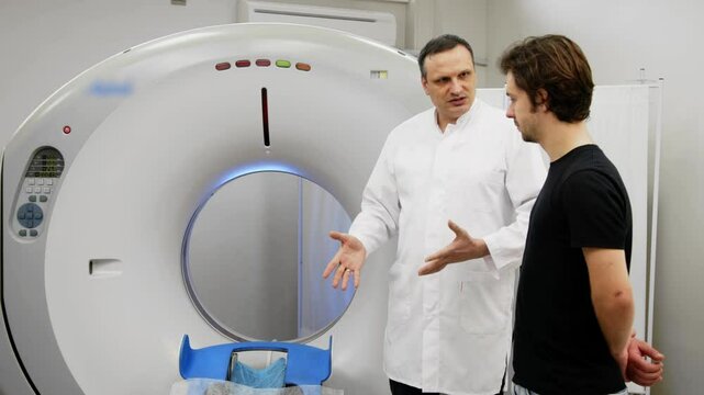 Before the MRI procedure, the patient receives doctor's recommendations. MRI scanner capsule. The doctor conducts a tomographic examination.