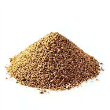 A small pile of ground cumin spice on a white surface.
