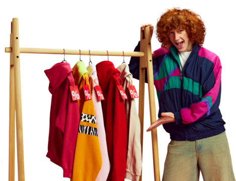Stylish savings. Shopper posing next to colorful selection of clothes, all marked with big discounts against transparent background. Concept of Black Friday, Cyber Monday, fashion, Flash Sale. Ad - Powered by Adobe