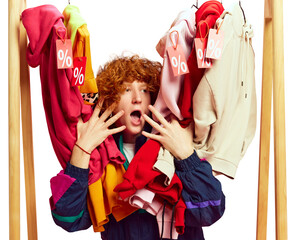 With sale tags all around, enthusiastic shopper clearly loving discounts, surrounded by colorful...