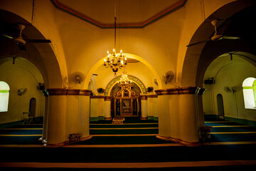 The mihrab of the Riau Sultan Grand Mosque guides the direction toward the qibla