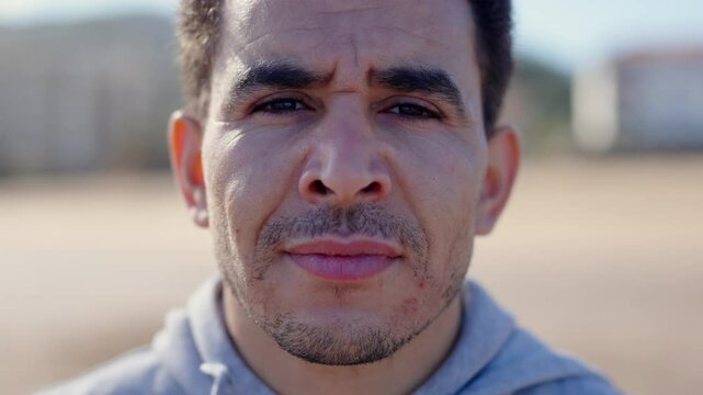 Closeup portrait of moroccan young adult man looking at camera.