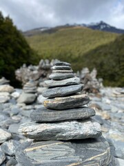 Stacks of rocks at Fantail Falls ,Haast Pass, South Island , New Zealand 