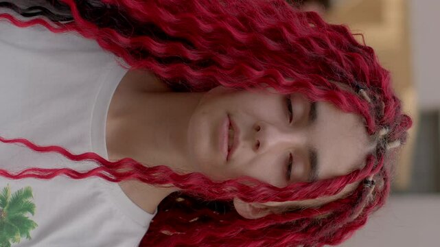 Stylish Red hair youth portrait of teenage girl student gazing into camera. Youthful energy and curiosity, young girl on cusp of adulthood. People with arrogant look, self-confidence and self-esteem