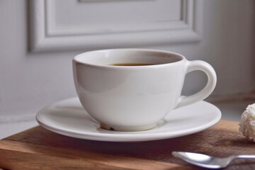 White cup with morning coffee