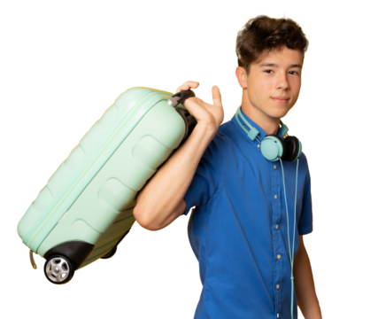 Vacation and travel concept. A young man in headphones holding suitcase over transparent background.
