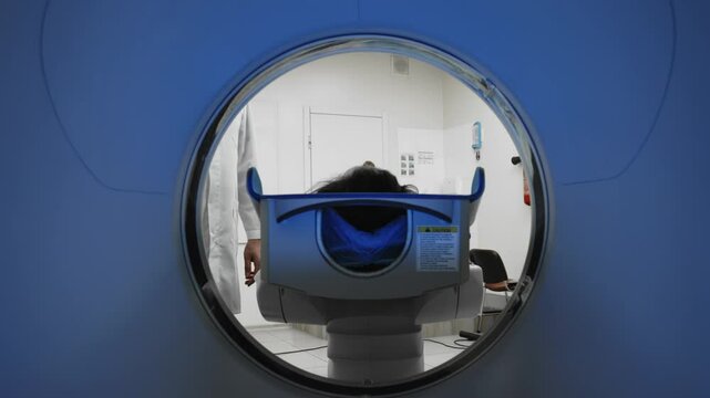 The patient lies inside an MRI or CT machine where the scan is performed. This high-tech equipment represents an innovation in diagnostics, providing accurate information for effective treatment.