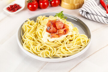Pasta spaghetti with salmon and stracciatella