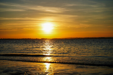Obraz premium Sunset over a beach in the South of England
