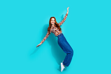 Full body photo of pretty young girl dance tiptoes wear trendy colorful outfit isolated on aquamarine color background