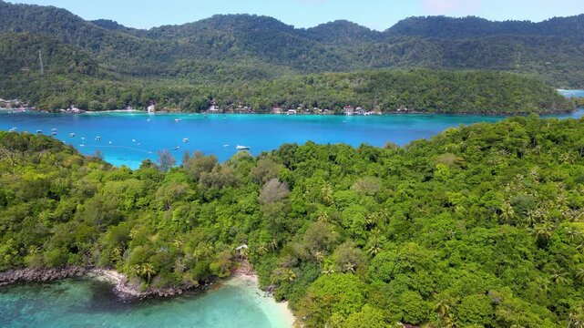 Emerald Waters Encircling a Tranquil Tropical Beach