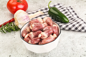 Fresh raw chicken hearts in the bowl