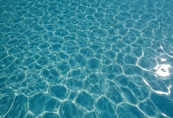 Clear blue water surface reflecting light in calm swimming pool